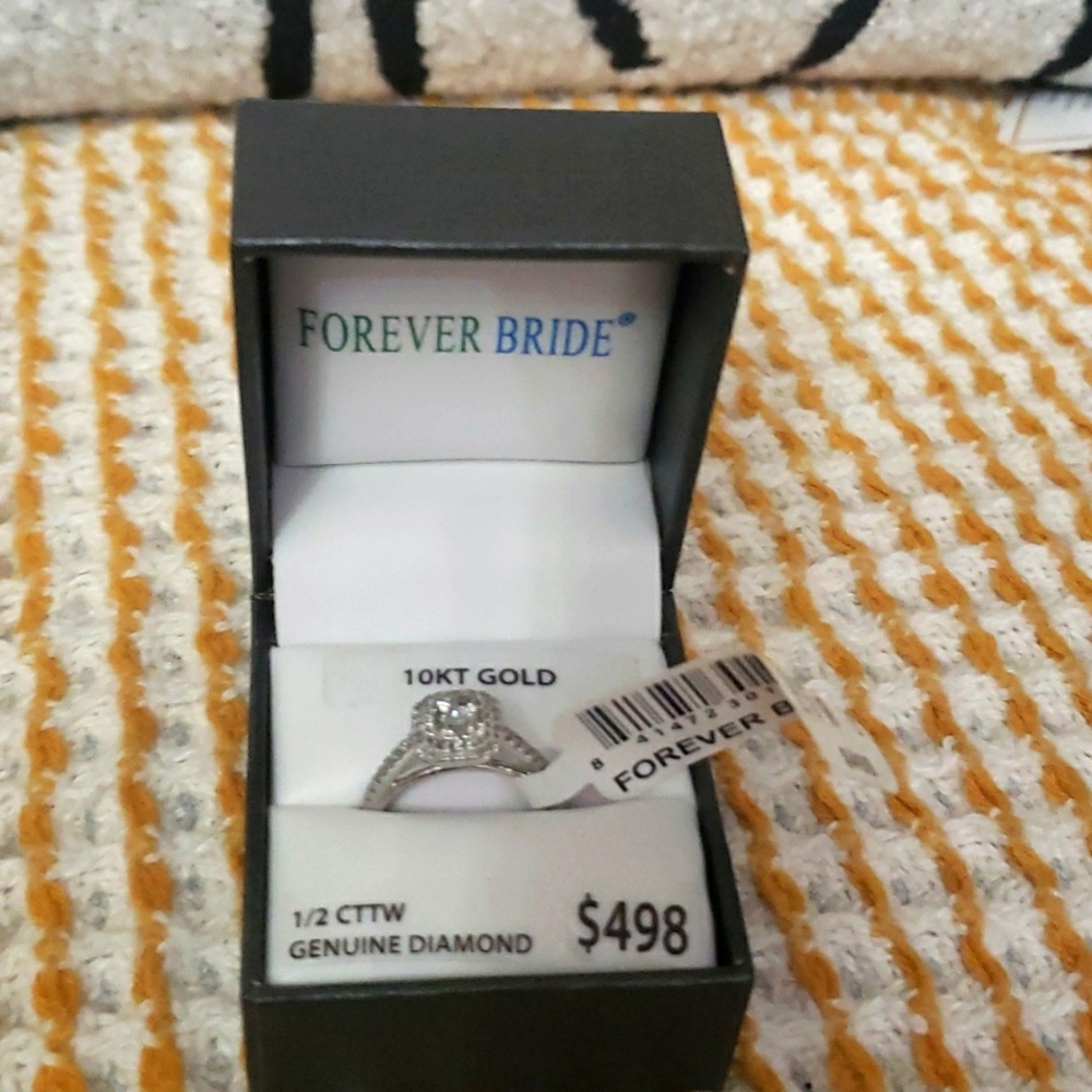 Brand New 1/2 carat Ginuwine Diamond & Gold ring.